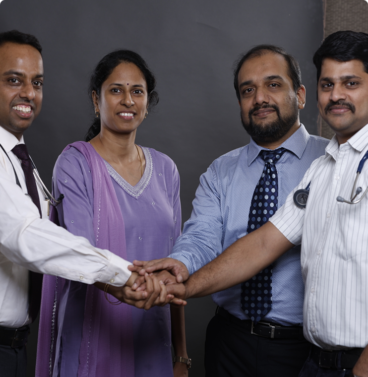 A doctor in a white coat and stethoscope listens to a middle-aged female patient's chest